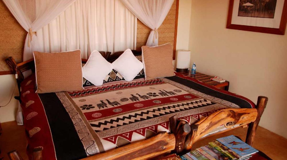 Un lit dans une chambre du Loisaba