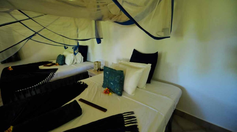 Lits dans une chambre à Zanzibar