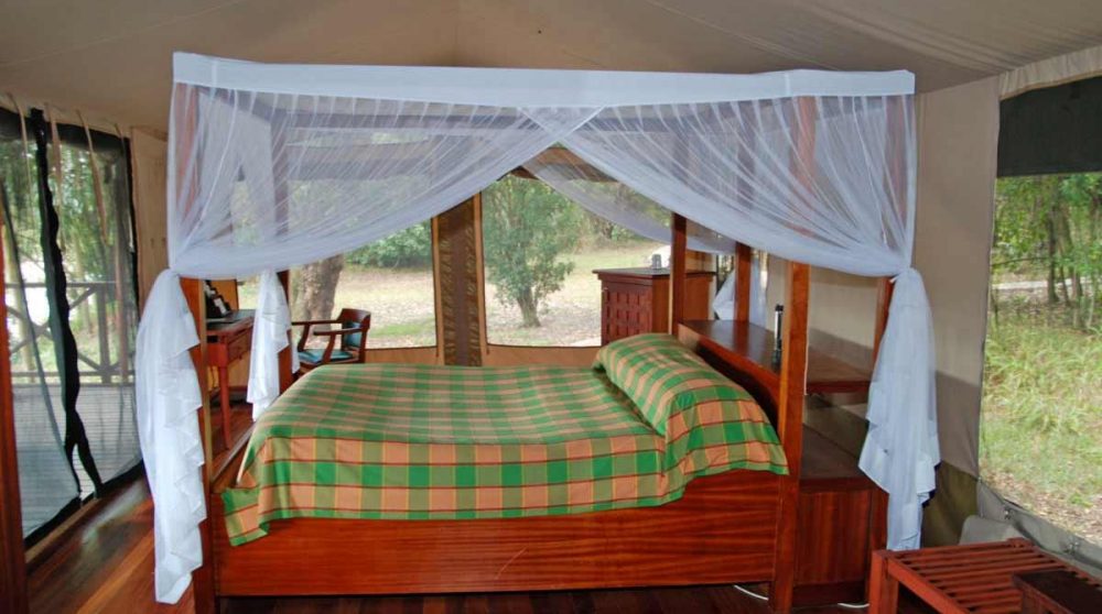 Le lit d'une tente dans le Masai Mara