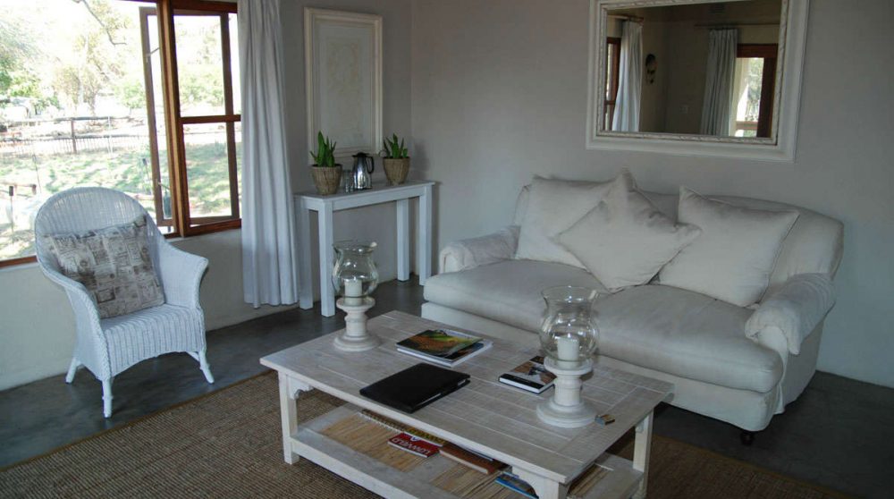 Salon dans un chalet familial à Sabi Sand