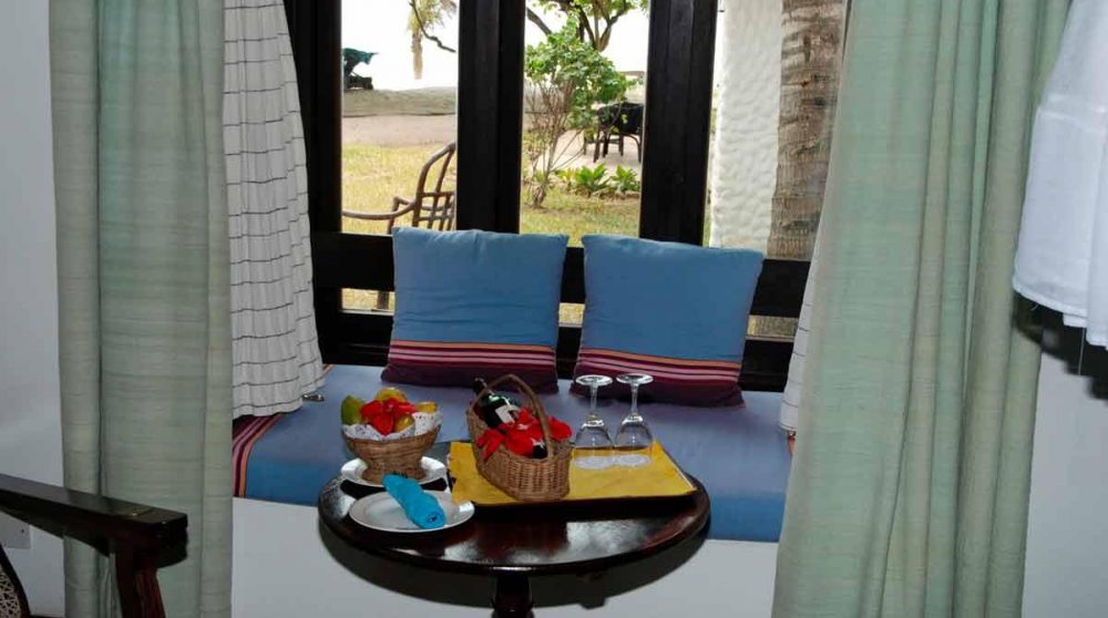 Vue sur le jardin depuis une chambre de l'Indian Ocean Beach Club