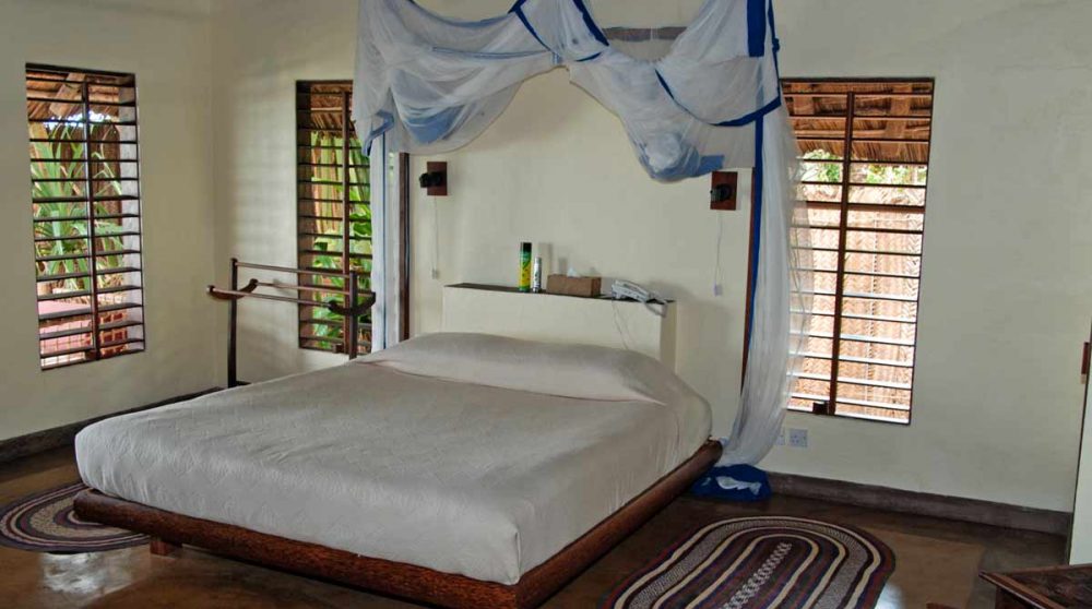 Lit double au Matemwe Lodge