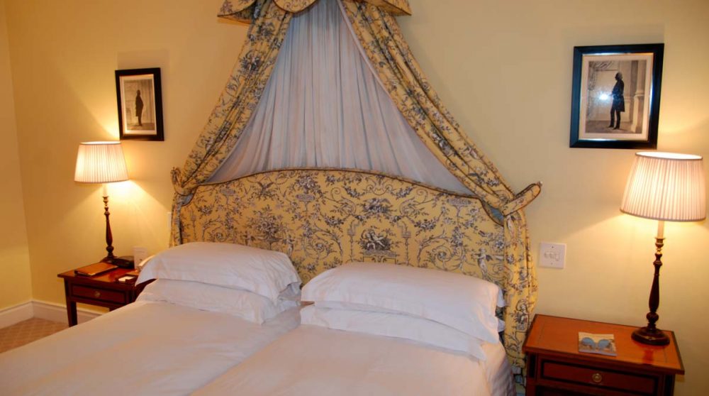 Lit dans une chambre deluxe suite du Mount Nelson