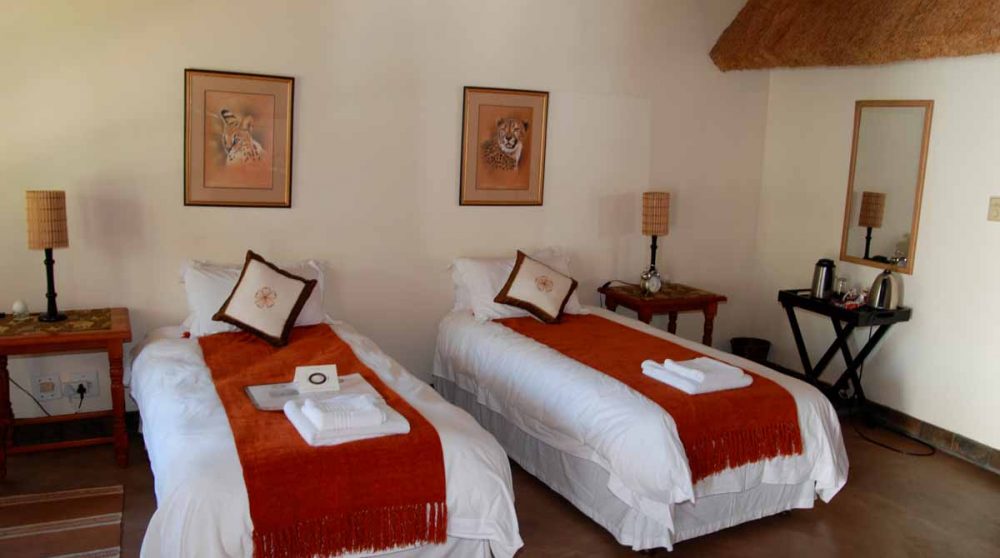 Une chambre avec lits simples en Afrique du Sud