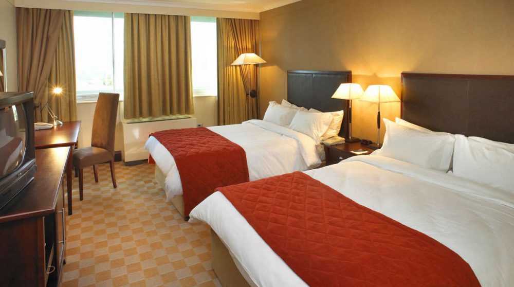 Chambre avec deux lits en Afrique du Sud