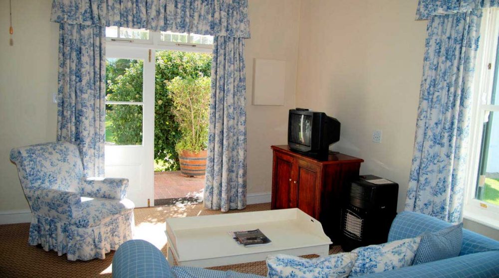 Canapé dans une chambre de l'hôtel Constantia Uitsig